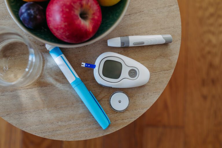 Close up of diabetes supplies and devices on table