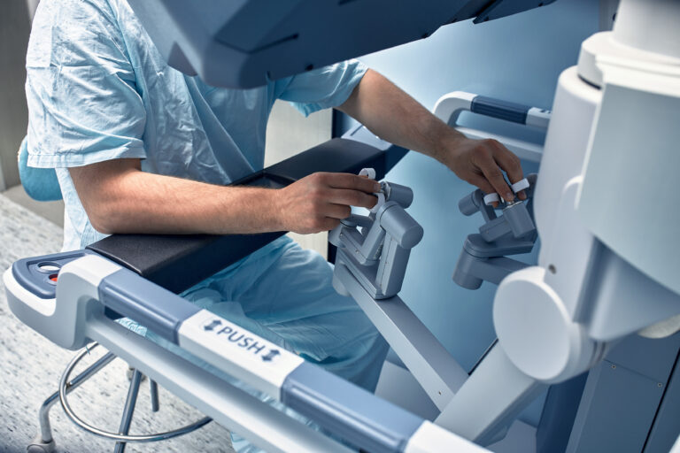 Hands of a surgeon at a computer robot. medical robot. Robotic Surgery